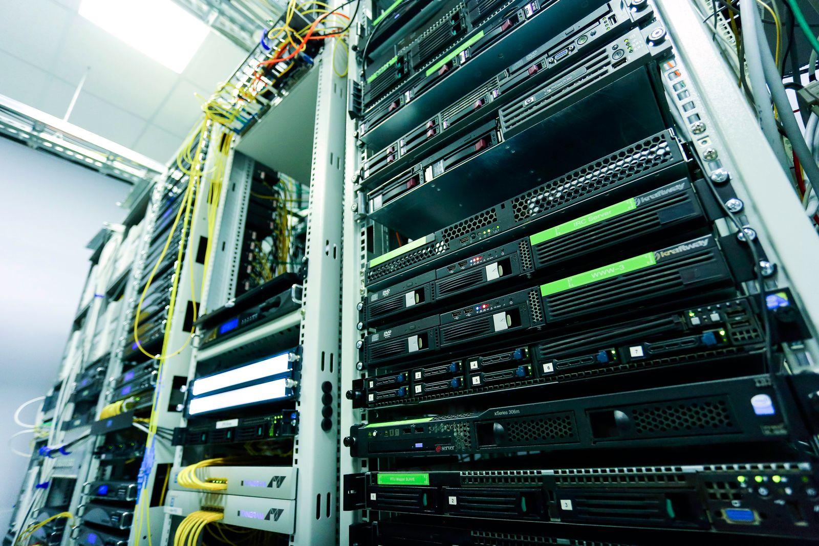 A high-tech server rack in a secure data center with network cables