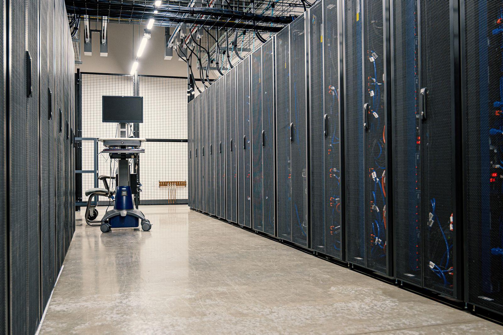 Steel framework cabinets housing servers and networking devices in a data center